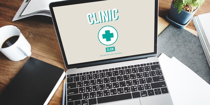 Open laptop showing clinic website interface, symbolizing trust and ethical considerations in medical blogging for healthcare practices.