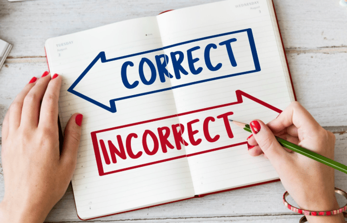 Notebook showing “Correct” and “Incorrect” with arrows, symbolizing the importance of managing accurate online facts to protect reputation and credibility.