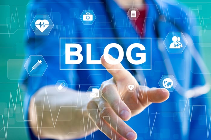 Doctor pressing a digital "Blog" button, symbolizing SEO-driven content marketing for medical practices.