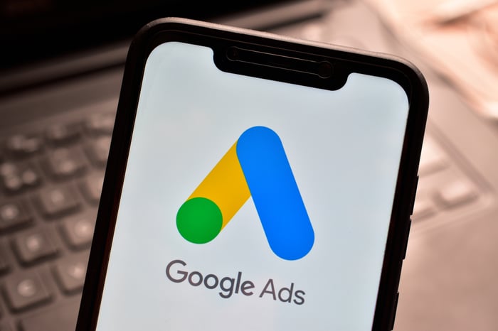 Close-up of a smartphone displaying the Google Ads logo, representing paid advertising in digital marketing strategies for doctors and healthcare practices.