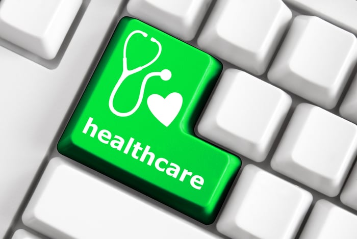 Green 'healthcare' Enter key with a stethoscope and heart icon, representing the importance of specific keywords for Medical SEO and MediSpa optimization.