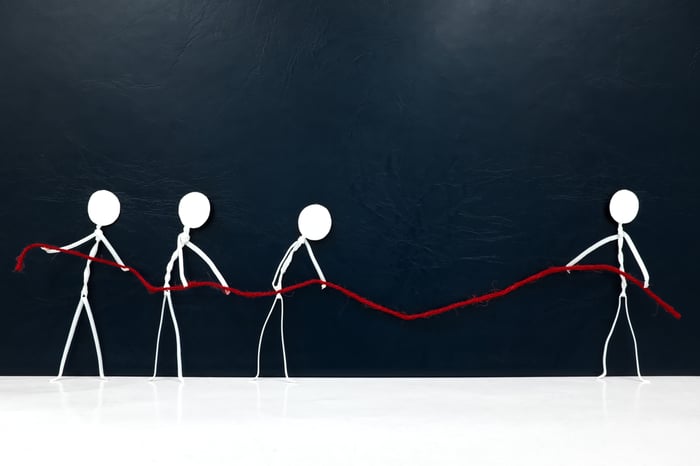 Visual comparison of a solo figure versus a team, representing the difference between managing healthcare SEO alone and partnering with a specialized healthcare SEO agency.