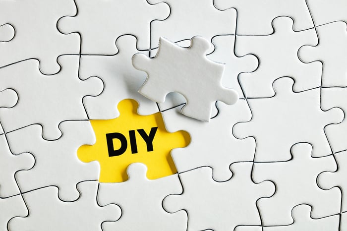 White puzzle pieces with one missing piece revealing the word DIY on a yellow background, symbolizing the gaps and challenges doctors face in do-it-yourself digital marketing.