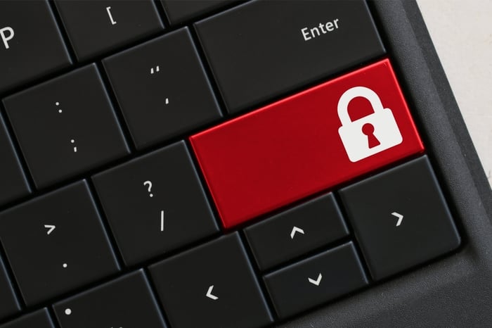 Keyboard with red padlock key symbolizing secure data practices and HIPAA-compliant digital protection for private practices.