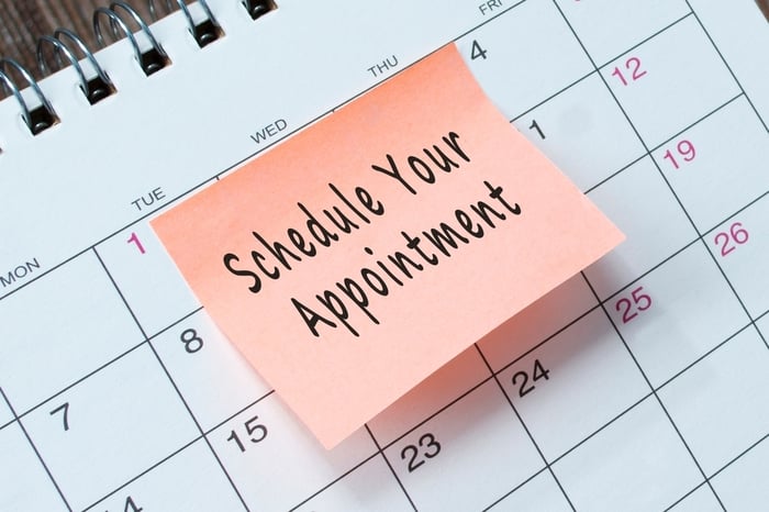 A calendar with a sticky note that reads “Schedule Your Appointment,” symbolizing how PracticeBeat’s online scheduling system helps private practices convert website clicks into real patient bookings through seamless digital scheduling.