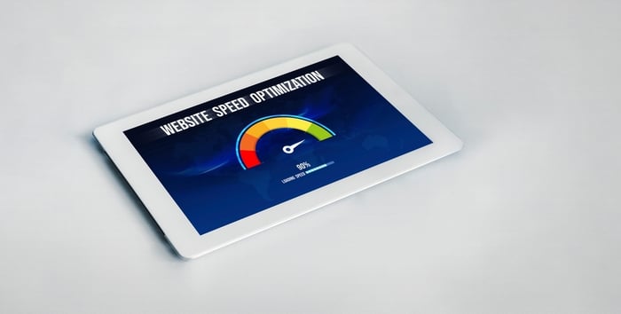 Tablet screen showing website speed optimization meter, highlighting the importance of fast-loading medical websites for better patient experience and SEO performance.