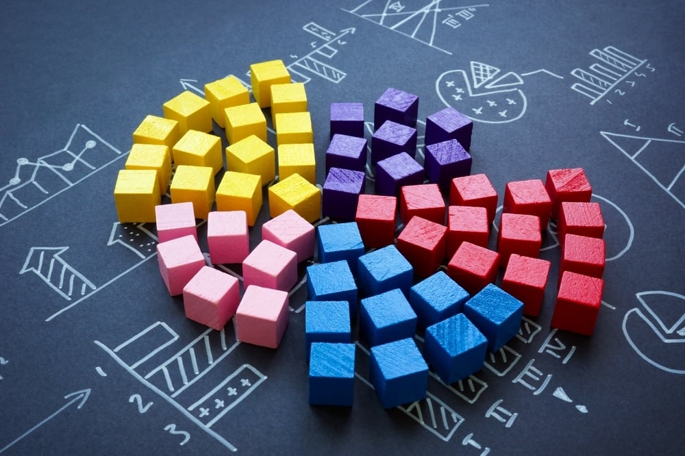 Colorful 3D cubes forming marketing charts and segments, illustrating strategic building blocks for modular content in healthcare marketing.