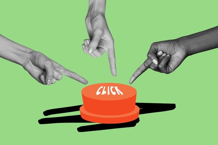 Three hands pointing to a red button labeled "CLICK" on a green background to illustrate the concept of the Click Trap in digital marketing for doctors.