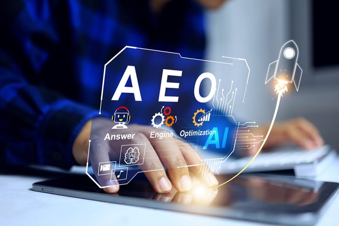 A person interacting with a futuristic digital interface displaying "AEO Answer Engine Optimization" and AI icons to illustrate the transition from keyword SEO to AI-driven digital marketing for doctors.