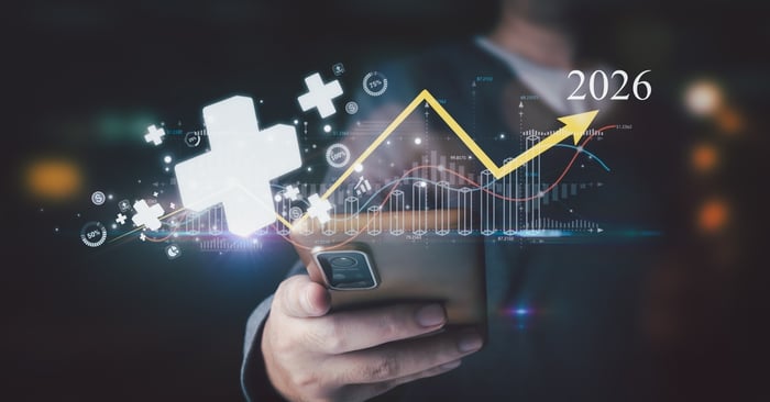 A digital visualization of a 2026 healthcare growth formula showing a person holding a smartphone with an upward-trending yellow arrow, glowing medical cross icons, and data bar charts representing high-impact patient acquisition metrics.