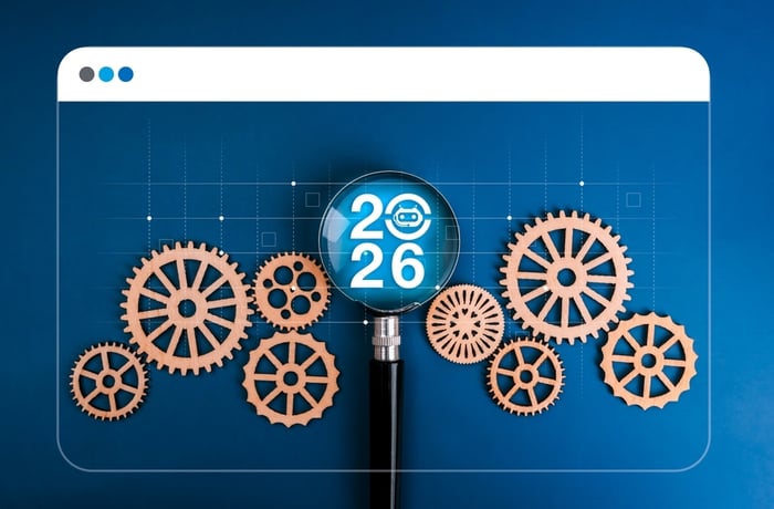 2026 concept with magnifying glass and digital gears illustrating AI, personalization, and the future of medical website development for plastic surgeons.